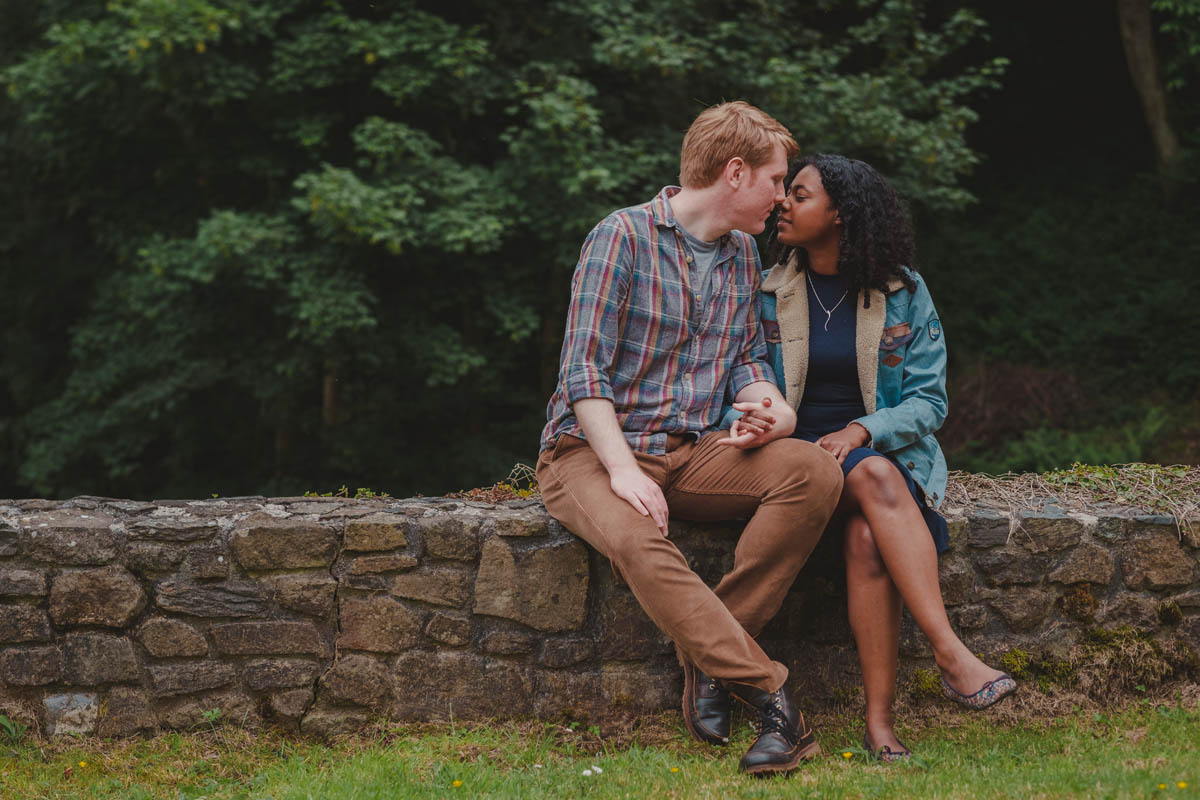 a newly engaged couple share a kiss