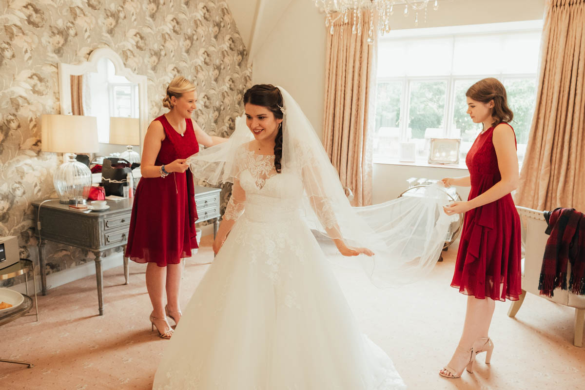 bride see's herself in her wedding dress for the first time 