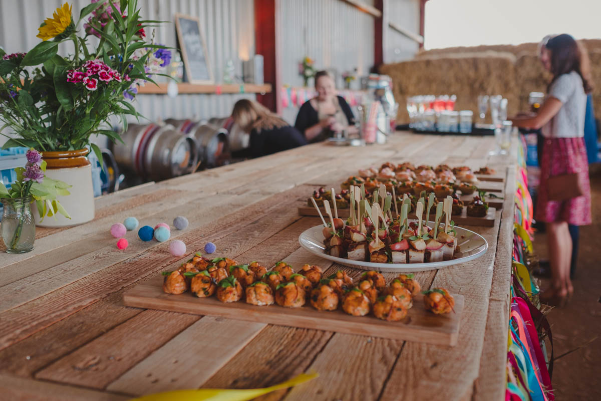 canapés sit on the bar at the Wiltshire farm wedding reception