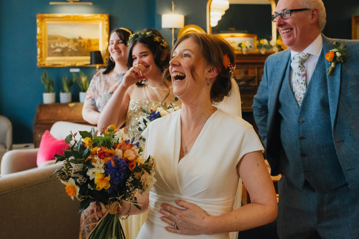 bride and her family laughing