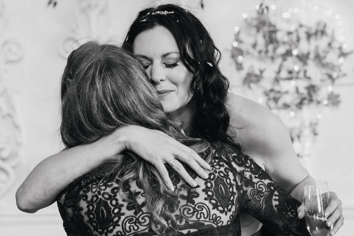 bride hugs her friend