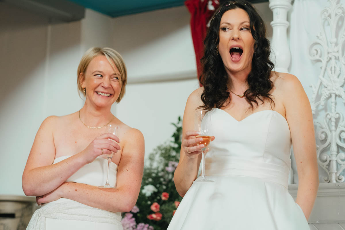 brides making funny faces at the speech