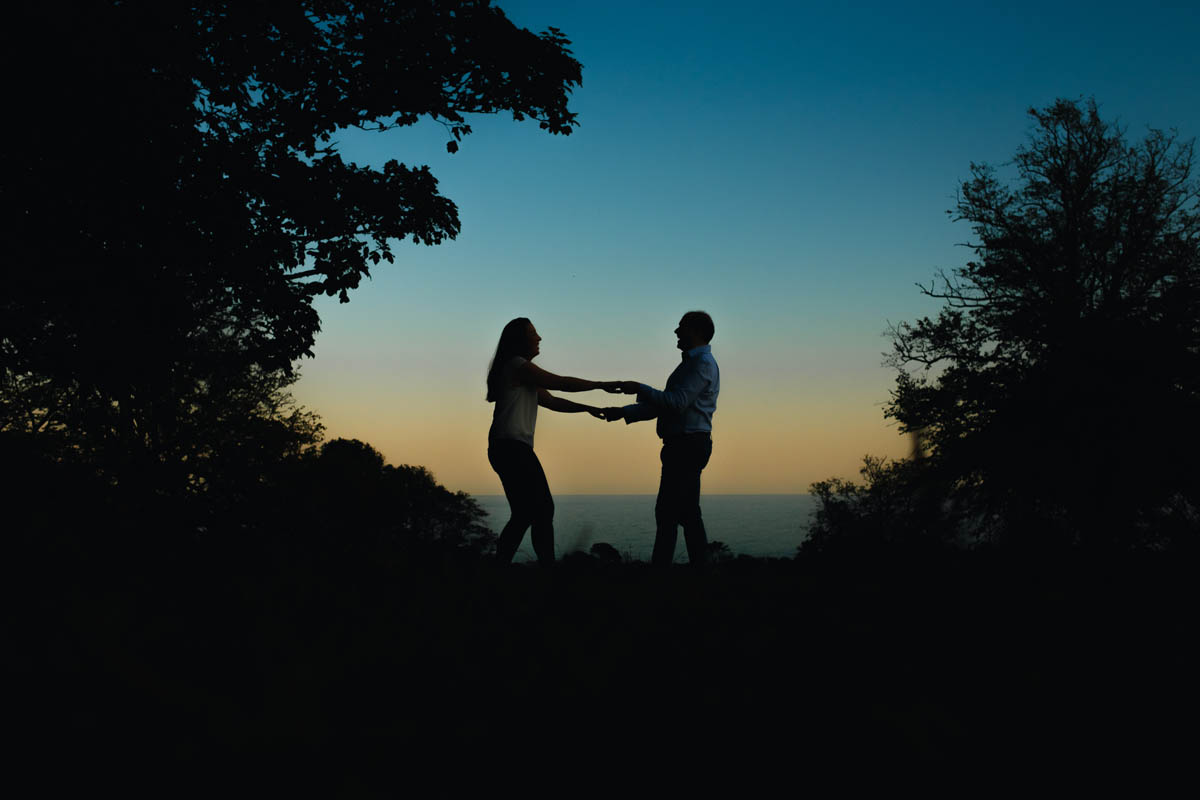 silhouette of a couple dancing on their engagement shoot