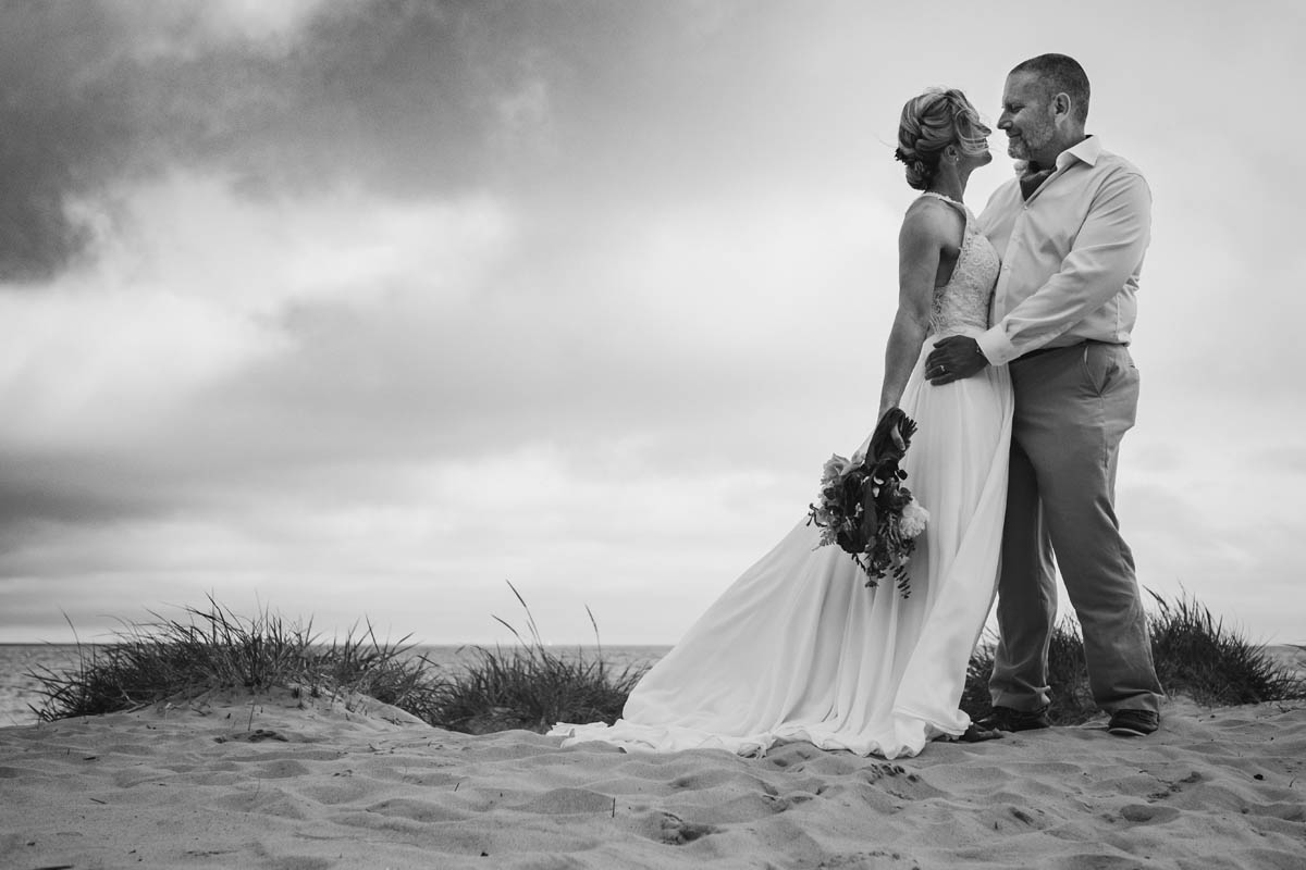 black and white image of newly-weds being romantic