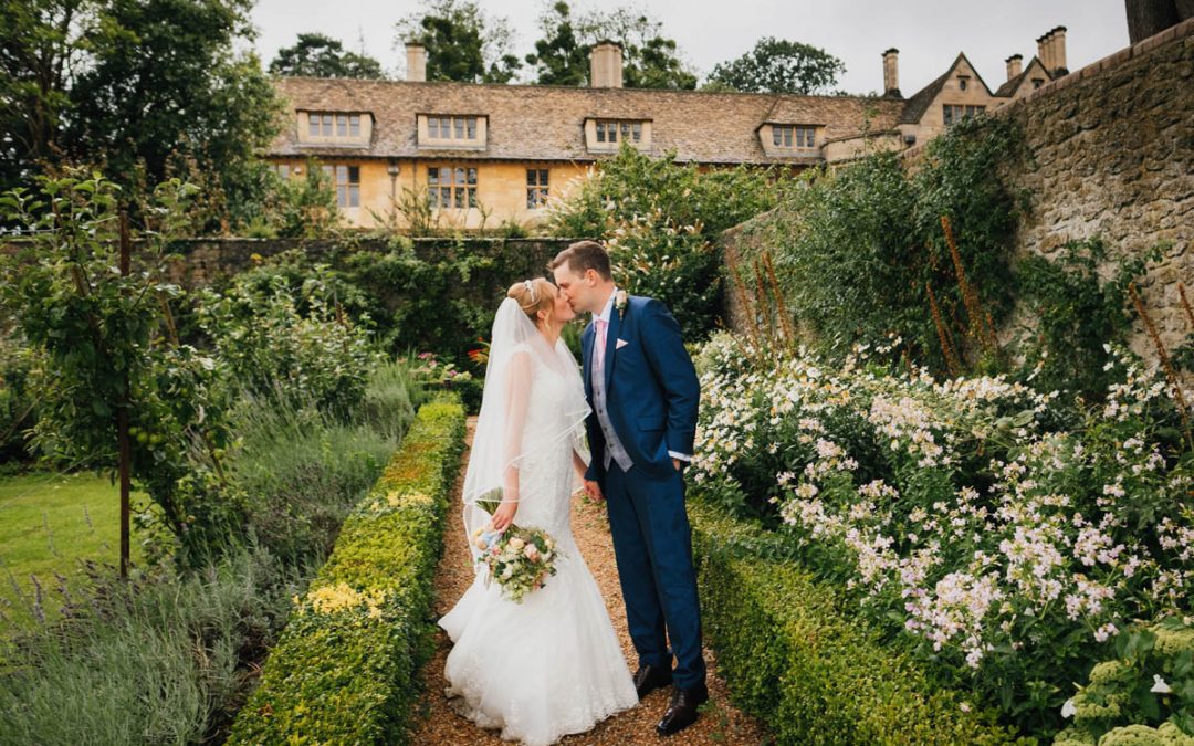 bride kisses her new husband on their wedding day at Coombe lodge, Blagdon