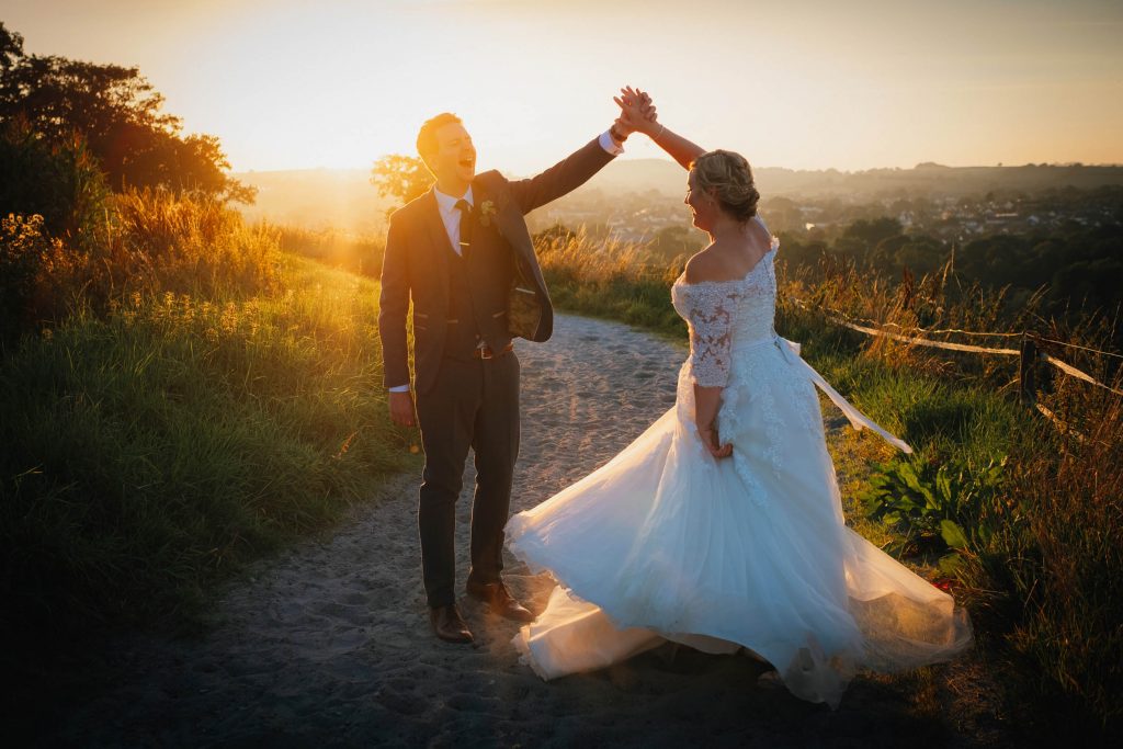 a bride and groom dance at golden hour at their bristol wedding