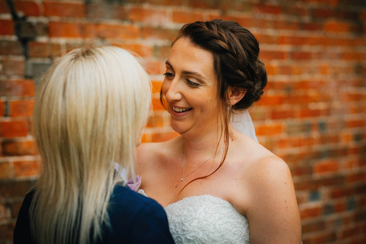 bride looks lovingly into her new wife's face