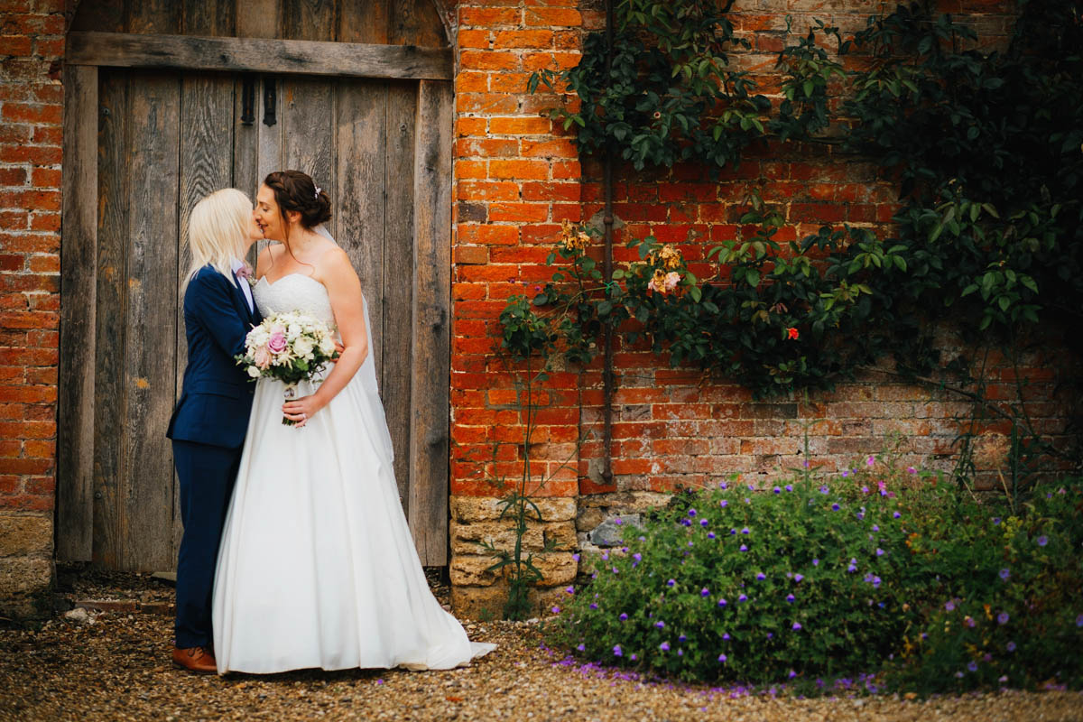 brides kiss at Orchardleigh estate
