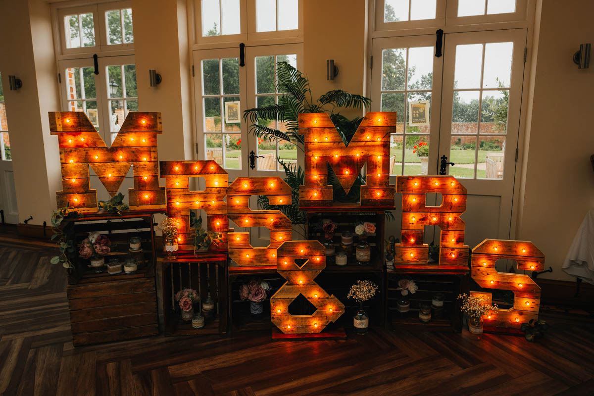 large mrs and mrs signs as wedding decorations