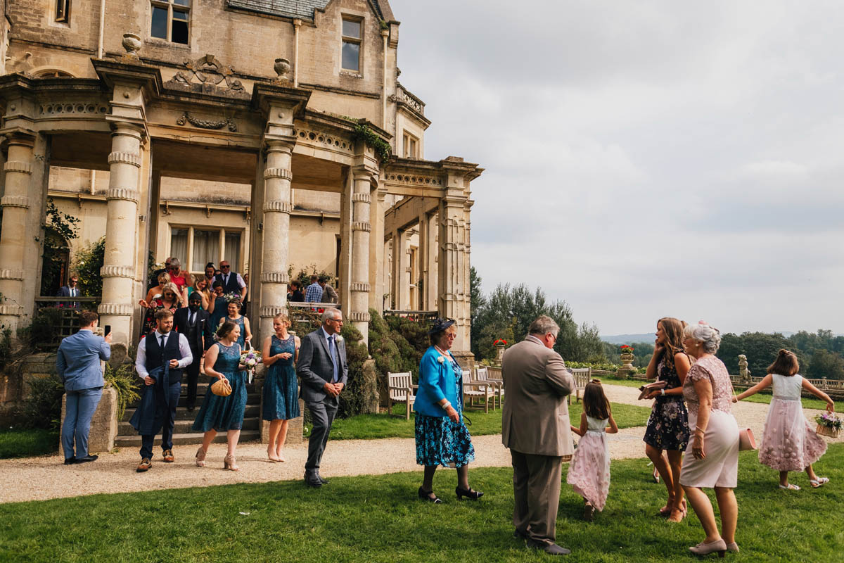 wedding guests descend from the vestibule into the gardens at Orchardleigh