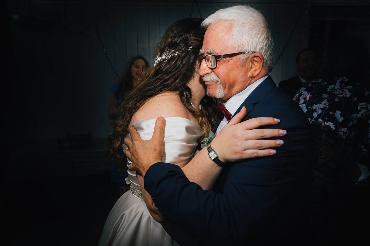 bride and her father hug