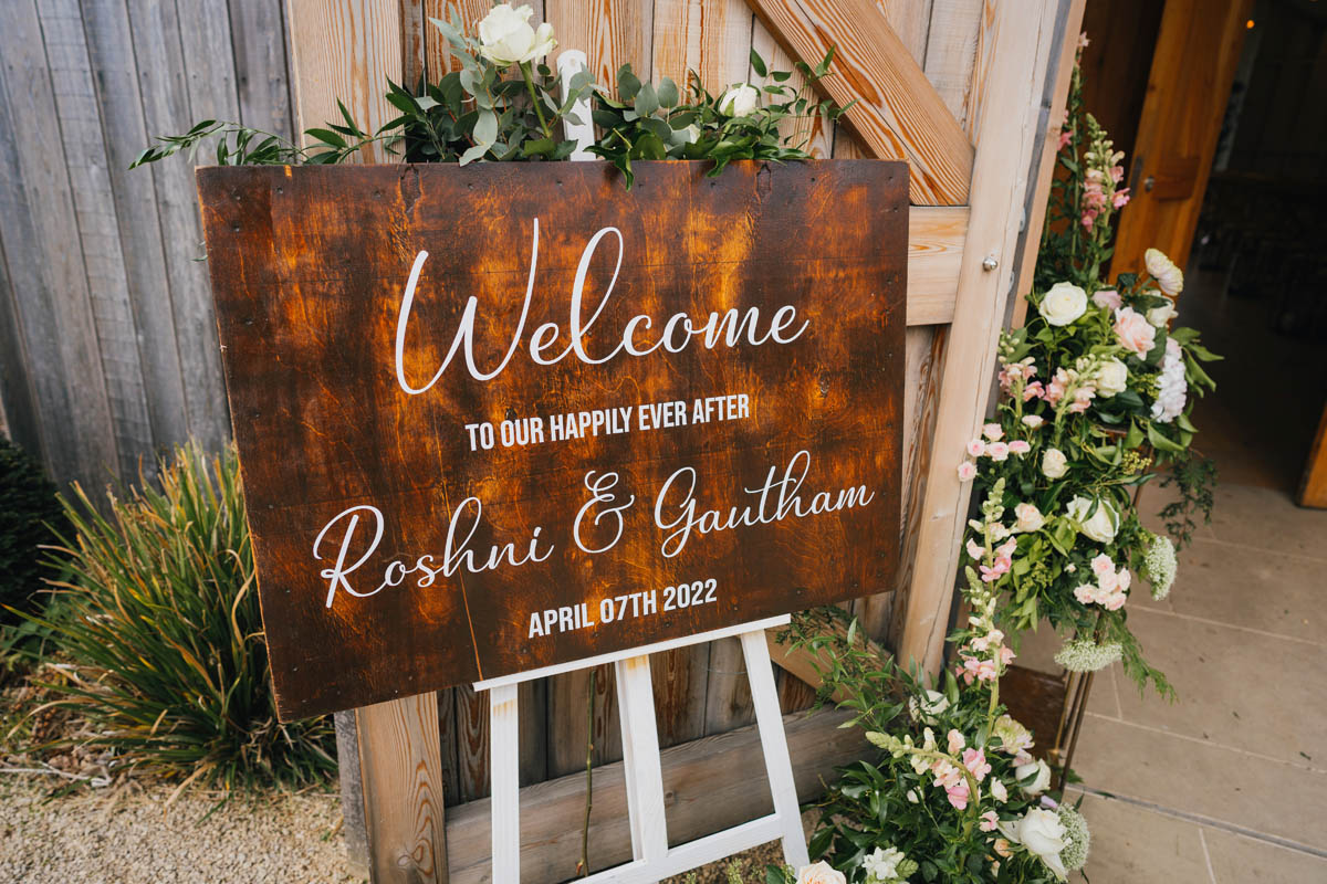 a welcome sign to the wedding