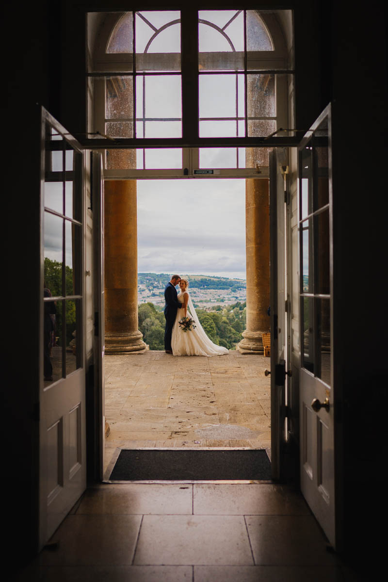 a silhouette of the bride and groom, framed in a doorway at Prior park