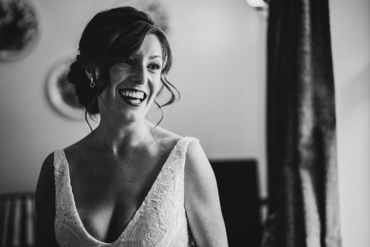 monochrome photograph of the bride from the chest up in beautiful window light
