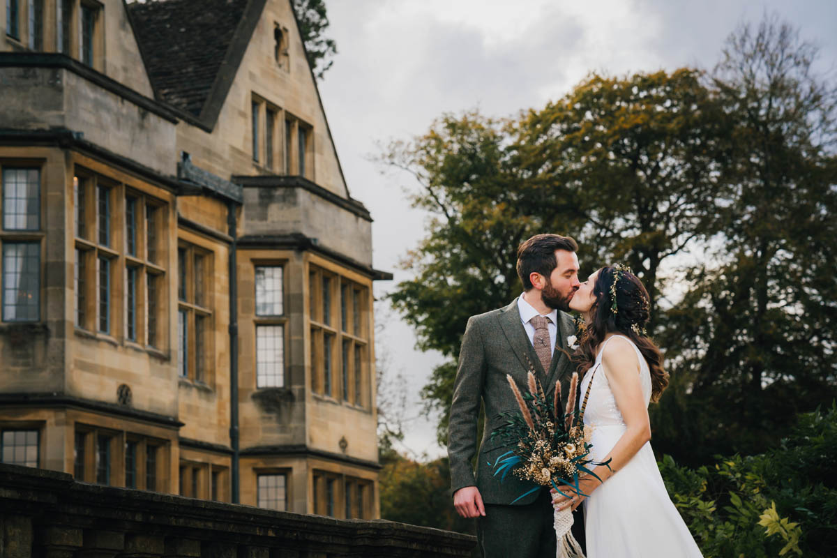the bride kisses her husband outside Coombe Lodge