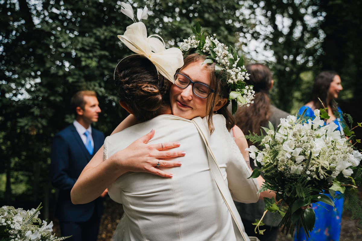 the bride hugs her mother