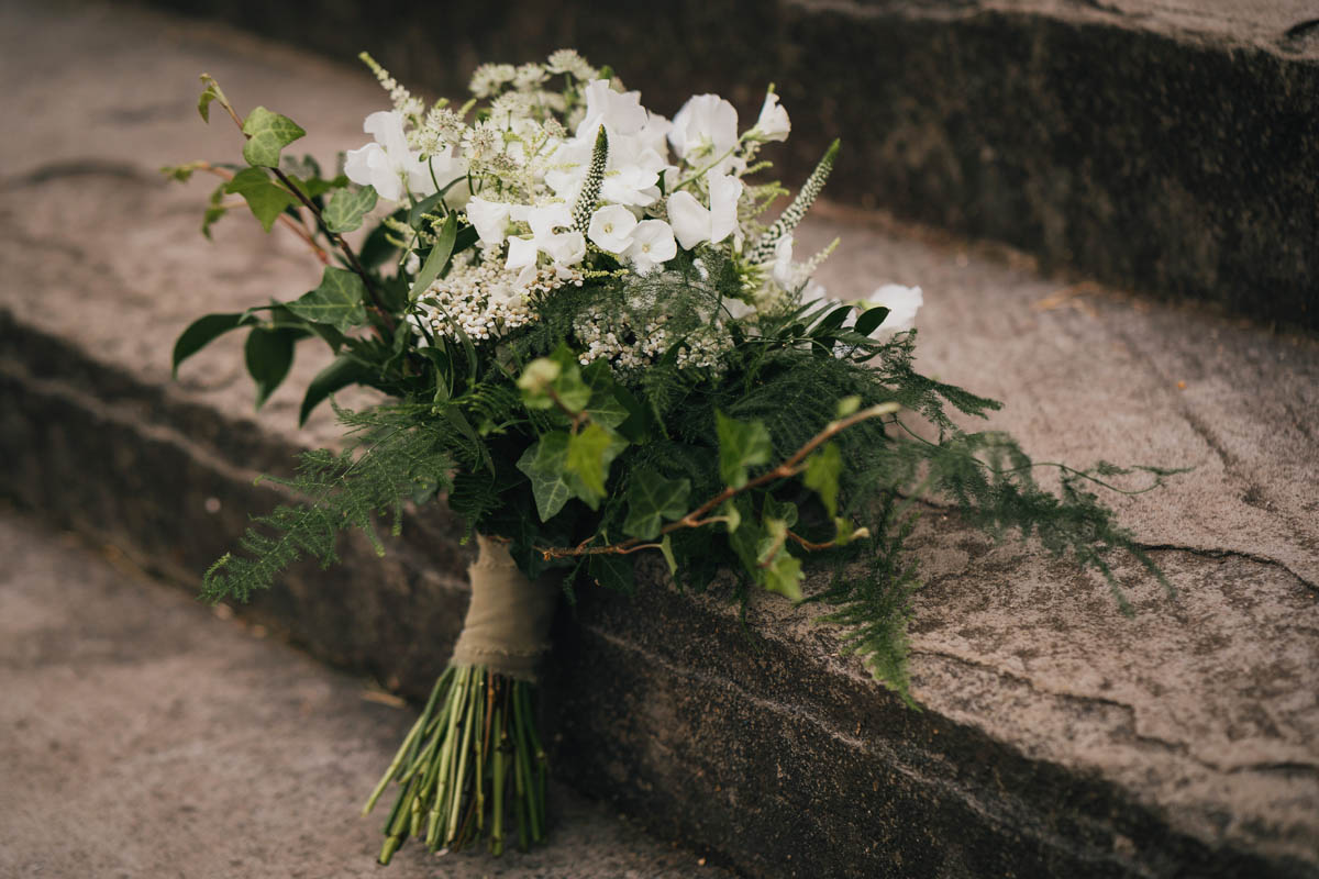 the brides bouquet which contains ferns and ivy
