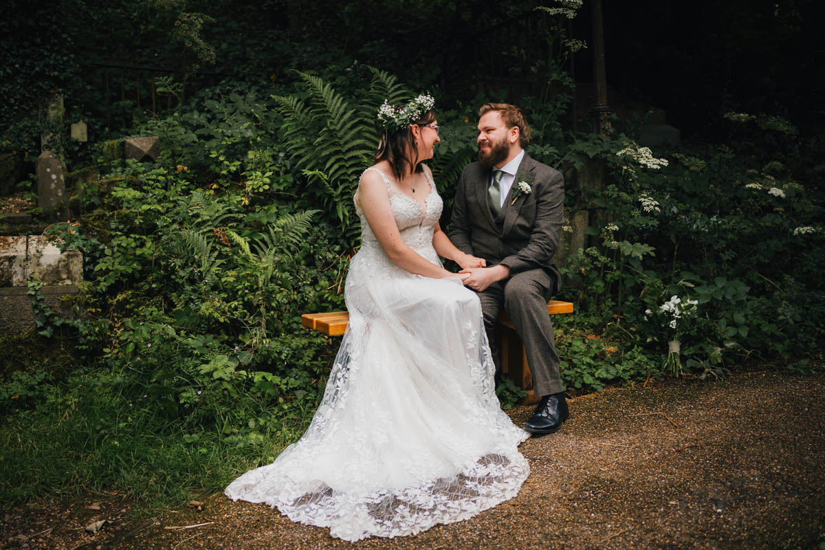 the bride and groom within Arnos vale's cemetery woodland