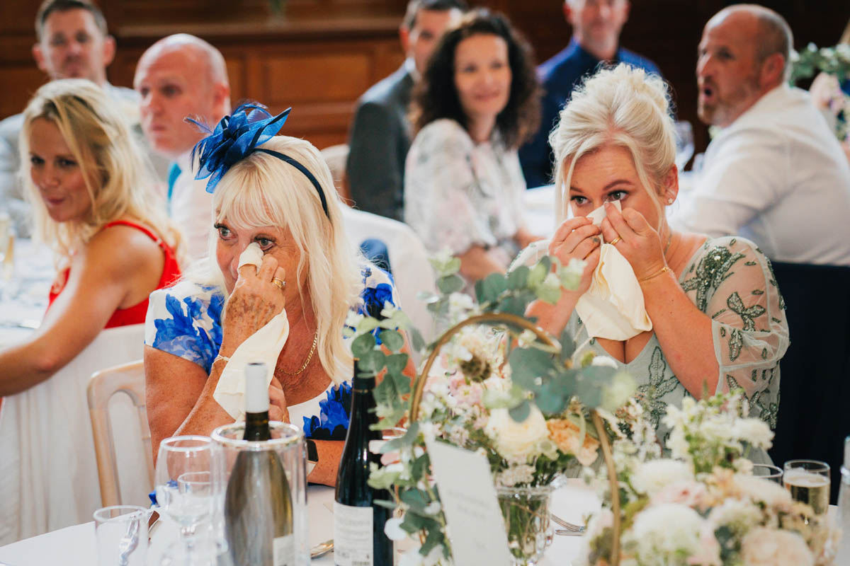 wedding guests wipe away happy tears during the speeches