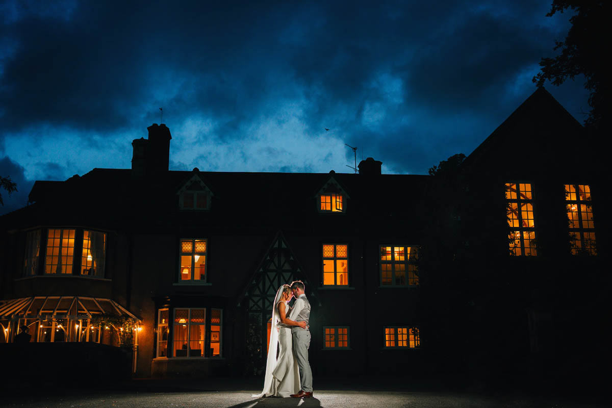 Night portrait of the bride and groom in front of Barley Wood Wedding Venue