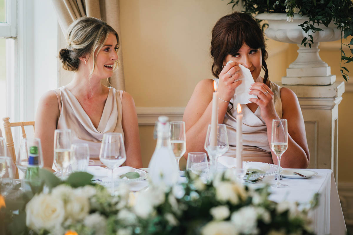 bridesmaids shed a happy tear during the wedding speeches