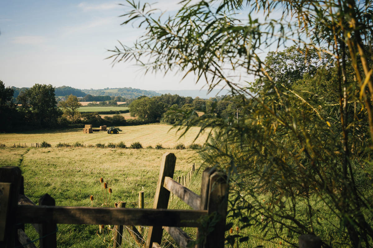 a tractor bailing in farmland