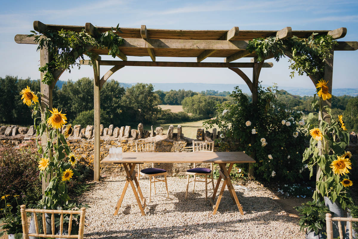 wooden structure adorned with sunflowers for the wedding ceremony