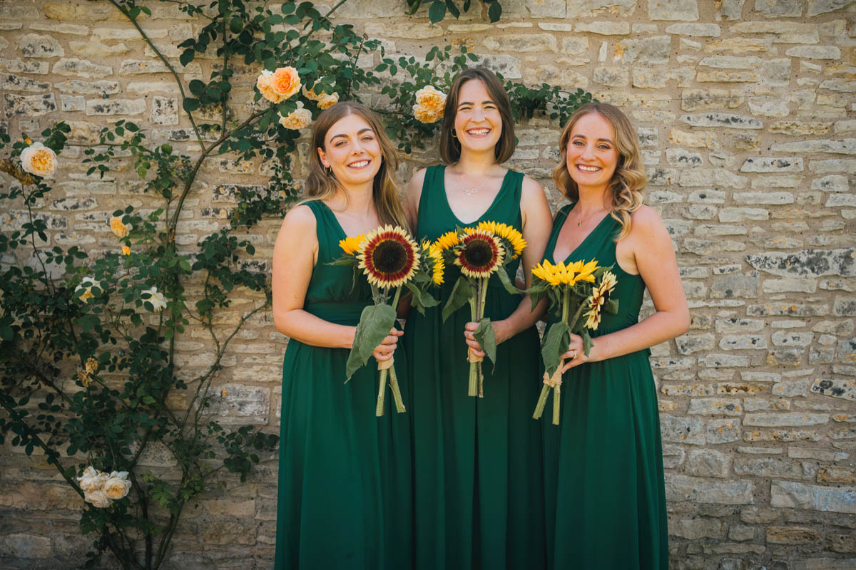 bridesmaids holding their sunflower bouquets