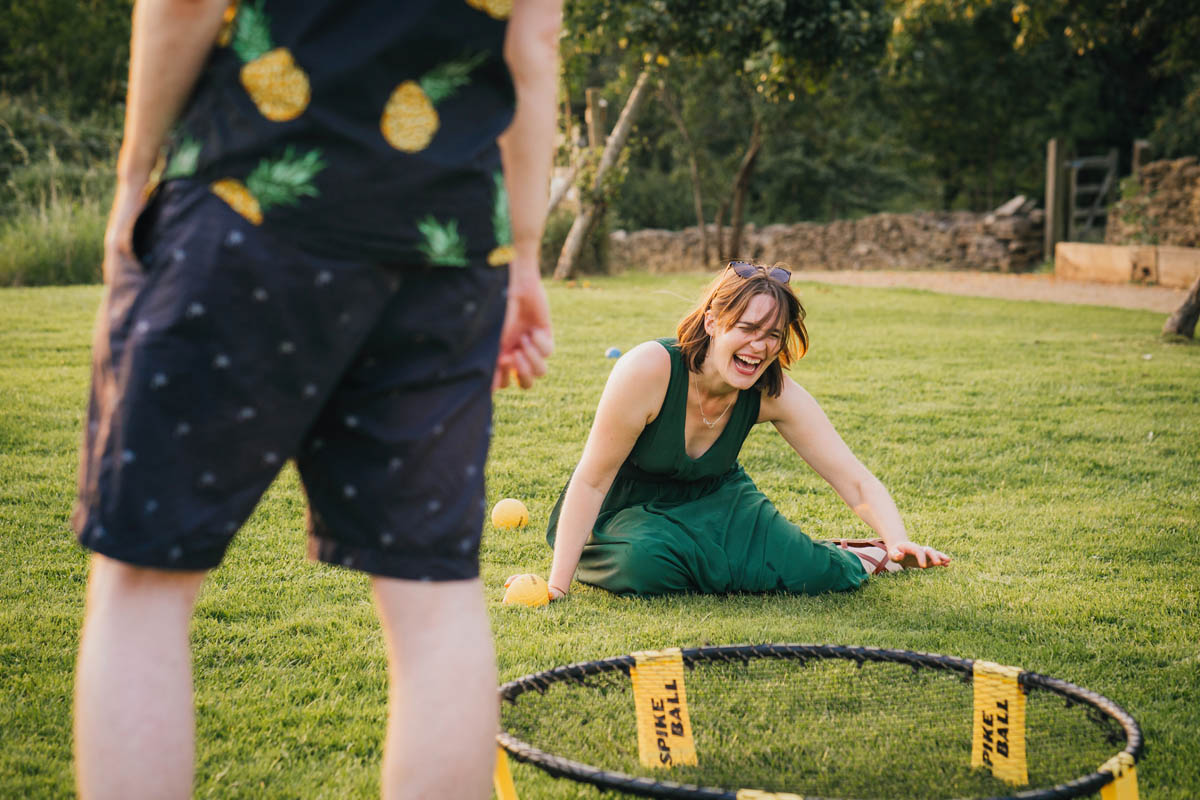 a bridesmaid laughs on the floor during a game