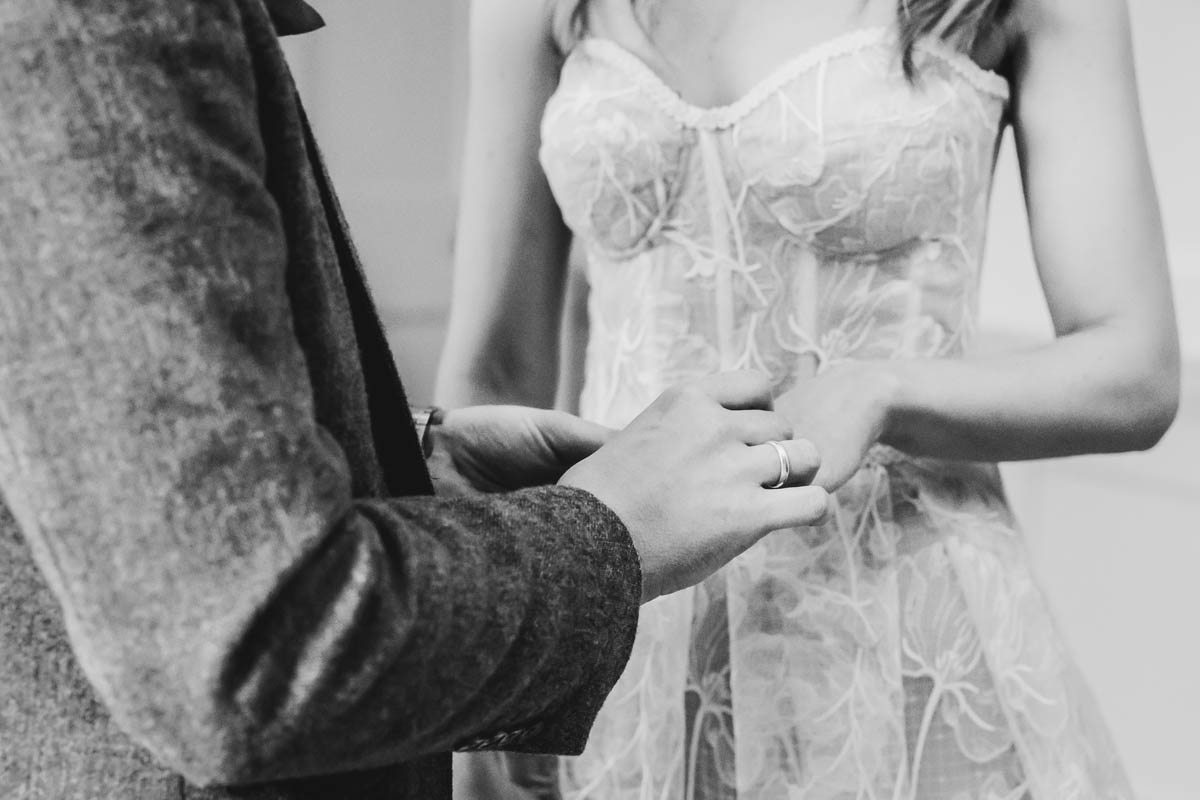 black and white close-up on the couple's hands