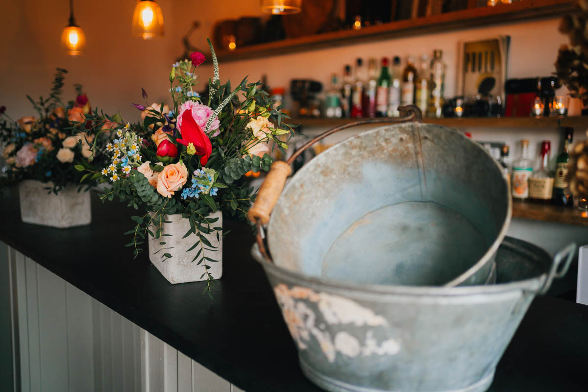 wedding bouquets and decorations on the bar at the Forge Bristol