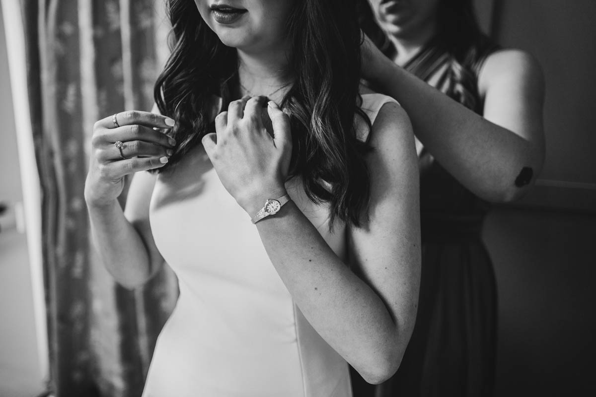 black and white close up of the brides hands