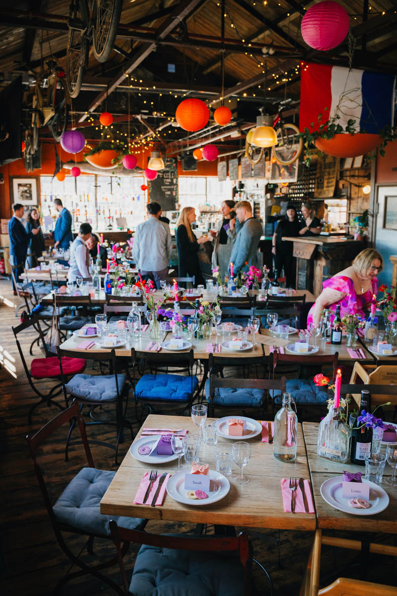 wedding decorations with bunting, lanterns, fairy lights and hot pink wedding favours