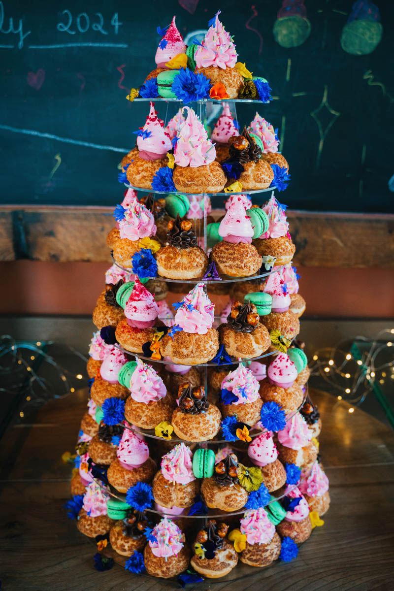 the wedding cake a tower of brightly coloured choux buns