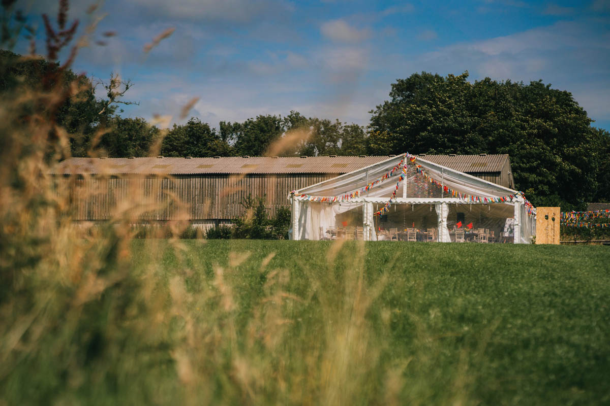 a marquee with brightly coloured bunting