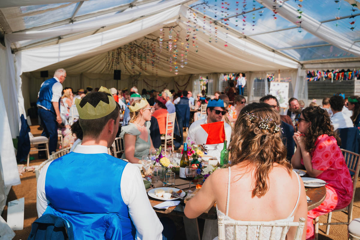 wide angle shot of wedding guests during the wedding breakfast at warren farm wedding venue