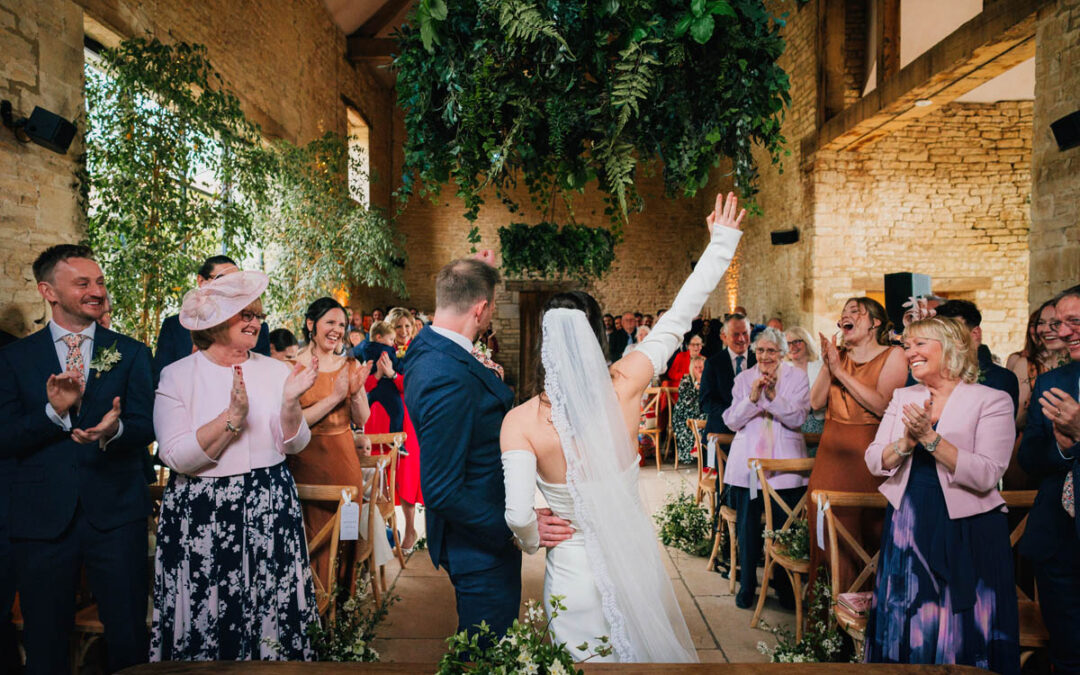 guests cheer as the couple are pronounced married