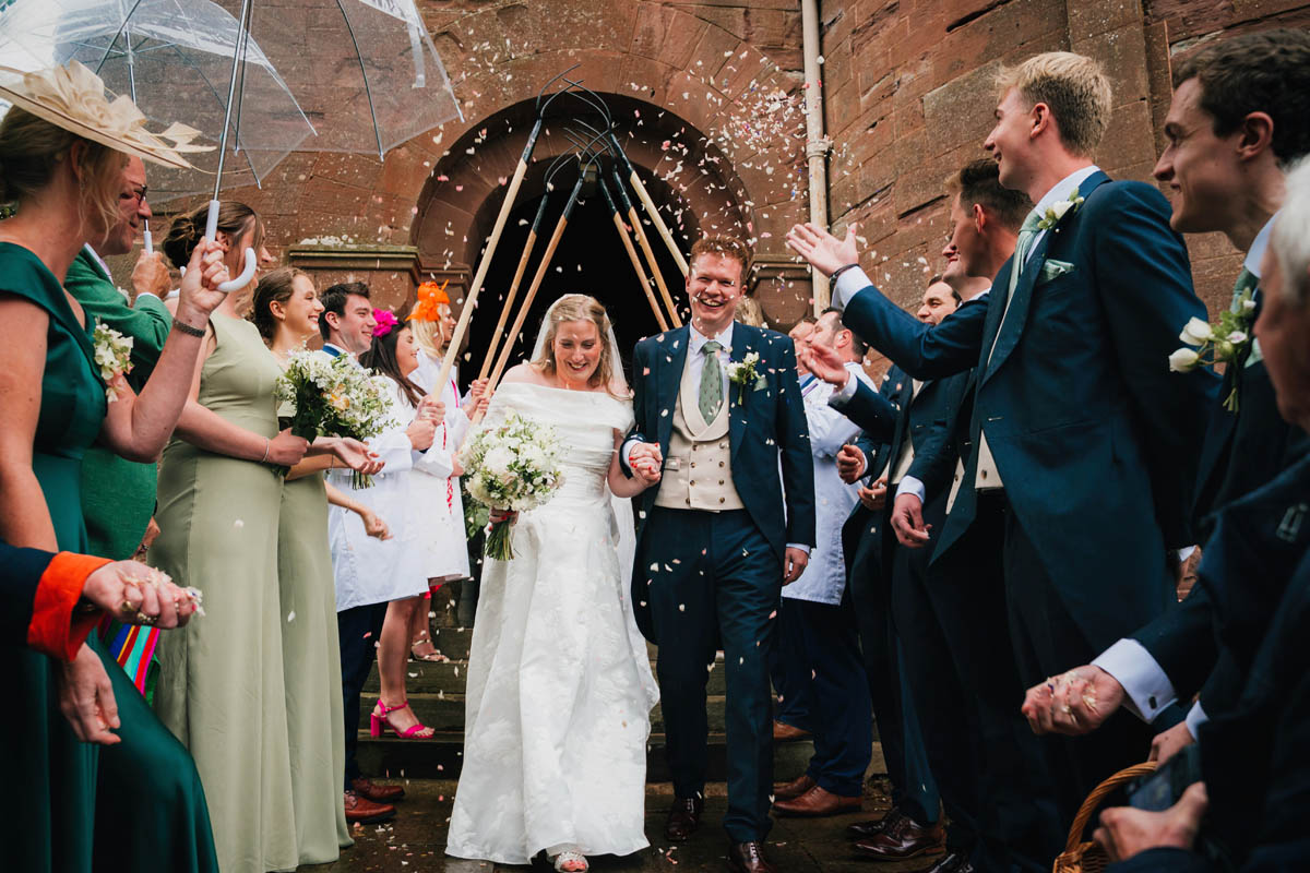 guests shower the couple in confetti