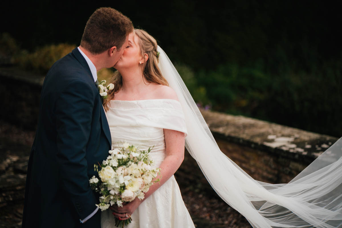 a portrait of a couple kissing