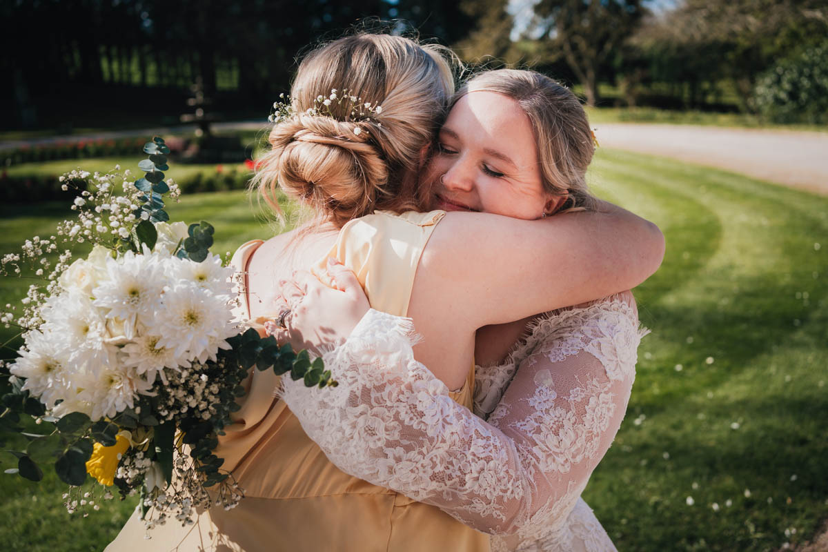 two women hug