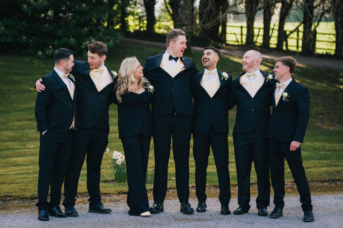 the grooms people posing for the camera
